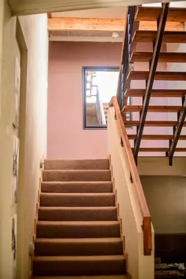 a set of stairs in a building with a window at Zebrina Guest House in Nelspruit