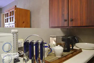 a kitchen counter with a coffee maker on a drying rack at Sonata in Dullstroom