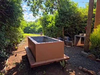 a box sitting on a table in a garden at Hartbeest Bush Stay #4 in Hartbeespoort