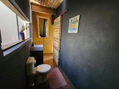 a bathroom with a toilet in a room at Hartbeest Bush Stay #4 in Hartbeespoort