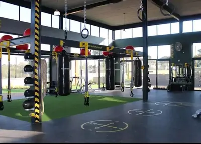 a gym with boxing equipment on a green floor at Vacation at the Blyde Riverwalk Estate in Pretoria