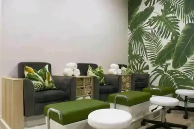 a living room with a couch and green accents at Vacation at the Blyde Riverwalk Estate in Pretoria
