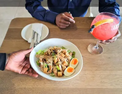 a bowl of food on a table with a drink at Vacation at the Blyde Riverwalk Estate in Pretoria