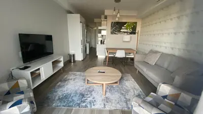 a living room with a couch and a table at Luxurious Resorts in Pretoria
