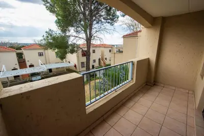 a balcony with a view of a courtyard at Havens corner in Sandton