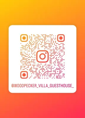 a white sticker with the words woodvelt villa guest house at Woodpecker Villa Guesthouse in Thabazimbi