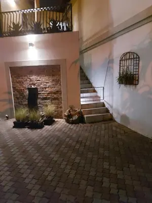 a building with a staircase and a brick wall at Bella's Place in Pretoria