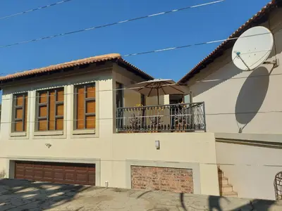 a house with a balcony with a dog on it at Bella's Place in Pretoria