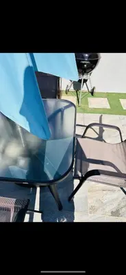 a table and a chair and a table and a table and a chair at The Pool_deck apartment in Lebowakgomo