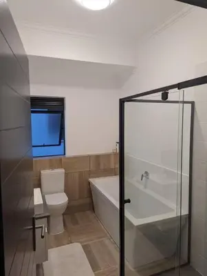 a bathroom with a tub and a toilet and a shower at Spacious 2 Bedroom Apartment in Midrand, Waterfall City - Business and Family friendly - 1 Elizabeth Place in Midrand