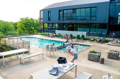 a person standing in front of a swimming pool at Spacious 2 Bedroom Apartment in Midrand, Waterfall City - Business and Family friendly - 1 Elizabeth Place in Midrand
