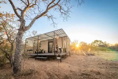 a tiny house in the middle of a field at Kamoka Camp in Hoedspruit