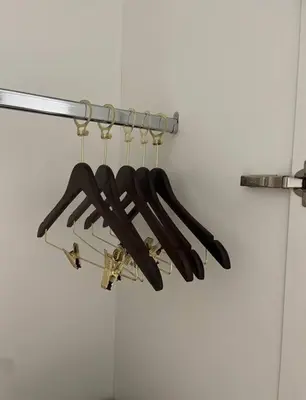 a bunch of baseball bats hanging from a rack at Ellipse Waterfall luxurious unit in Midrand