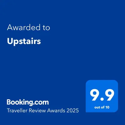 a blue text box with the words awarded to ustris at Upstairs R-2 Self-Catering Unit in White River