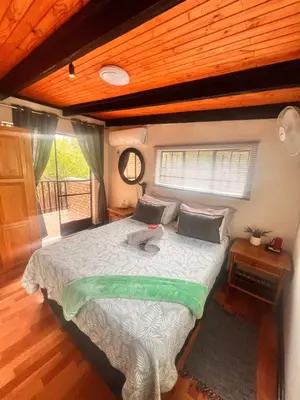 a bedroom with a bed with a stuffed animal on it at Bundu in Marloth Park