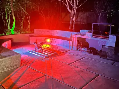 a lit up patio with red and green lights at Bundu in Marloth Park