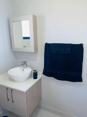 a bathroom with a sink and a mirror at Dubai 2 in Midrand
