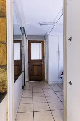 an empty hallway with a door and a tile floor at Stamvrug 9 B in Nelspruit