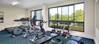 a fitness room with a gym with tread machines at STAY Menlyn in Pretoria