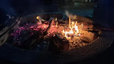a fire in a brick oven with flames at Hambana Lifestyle Lodge in Musina