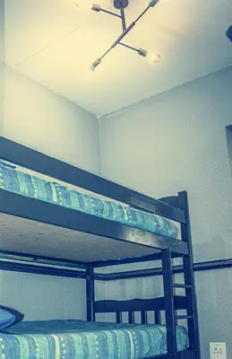 a bunk bed in a room with a ceiling fan at 19 @ Pendleberry in Bela-Bela