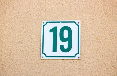 a sign with the number on a wall at 19 @ Pendleberry in Bela-Bela