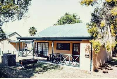 a building with a bench in front of it at 19 @ Pendleberry in Bela-Bela