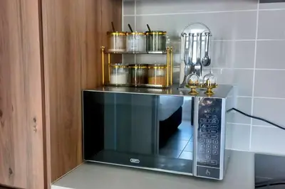 a microwave on a counter in a kitchen at The Blyde Luxury Retreat in Pretoria