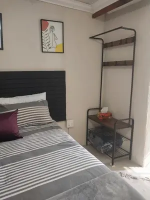 a bedroom with a bed and a bunk bed at Comfort place 3 in Pretoria