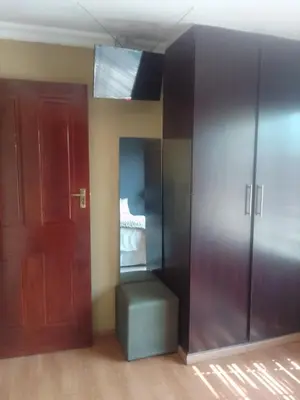 an empty room with a closet and a door at Room2rent Centurion in Pretoria