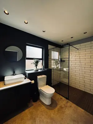 a bathroom with a toilet and a sink at Highland Gate Range View in Dullstroom