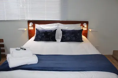 a bedroom with a bed with towels on it at Sunny Stay in Groblersdal