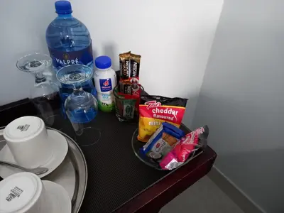 a table with some food and drinks on it at REALJOY GUEST SUITES in Centurion