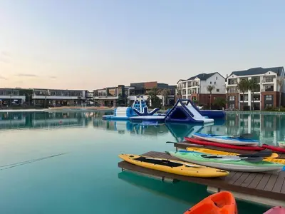 a bunch of boats are sitting in the water at The Blyde in Pretoria