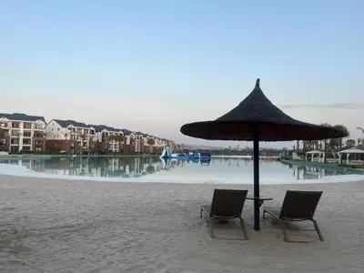two chairs and an umbrella on a beach at The Blyde in Pretoria
