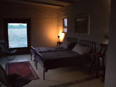 a bedroom with a bed and a window at Horizon Savannah in Dinokeng Game Reserve