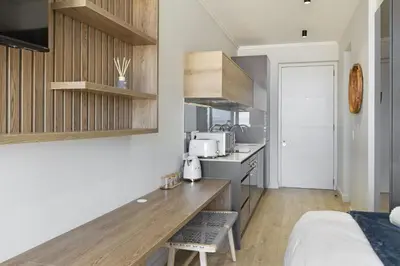a kitchen with a wooden counter top in a room at Ellipse Waterfall 31002 in Midrand