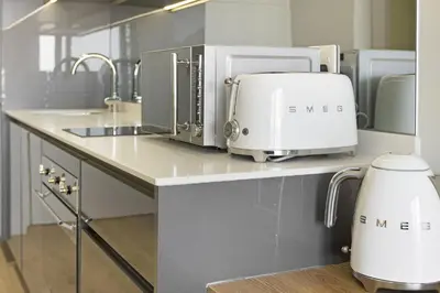 a kitchen with a counter with a toaster and toasters at Ellipse Waterfall 31015 in Midrand