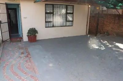 an empty patio in front of a house at Unitrainview guest house in Pretoria