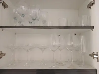 a bunch of wine glasses on a shelf at Spacious 2 Bedroom Apartment in Carslwald, Midrand - Business and Family friendly - 2 Elizabeth Place in Midrand