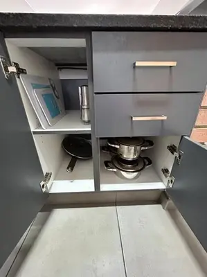 a kitchen with a counter with a stove in it at The Place @ Mall of Africa in Midrand