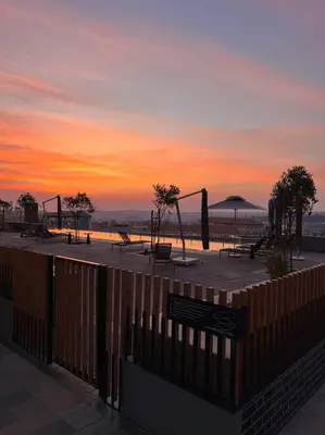 a park with benches and a playground at sunset at Ellipse Executive apartment in Midrand