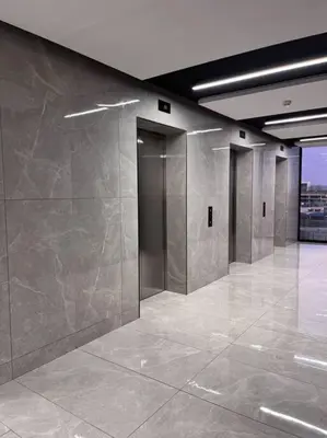 a lobby with stainless steel walls in a building at Ellipse Executive apartment in Midrand