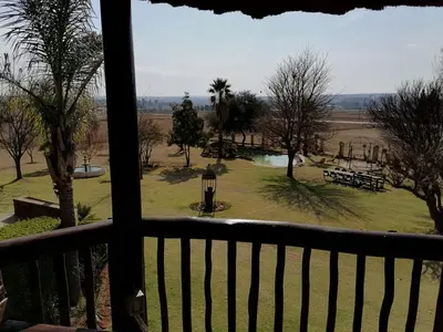a view of a park from a balcony at Kwena Maribane Lodge in Erasmus
