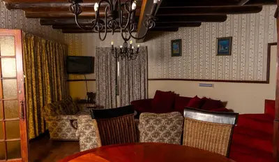 a living room with a couch and a table at Manor House at Harties Lodge - Meerhof in Hartbeespoort