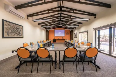 a conference room with a large table and chairs at Hannah Game Lodge in Ohrigstad