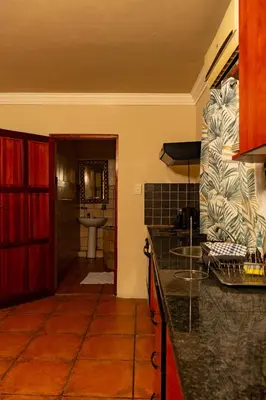 a kitchen with a counter top and a sink at Harties Lodge - Meerhof Bay View 6 in Hartbeespoort
