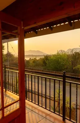 a view from a porch with a view of the train tracks at Bay View 9 at Harties Lodge - Meerhof in Hartbeespoort