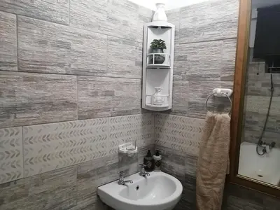 a bathroom with a sink and a mirror at Modern style Apartment in Pretoria-Central in Pretoria