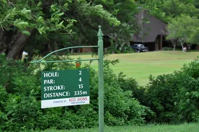 a sign in a field with a house price sign at Kruger Park Lodge Unit No. 524 in Hazyview